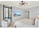 Main bedroom with a king-size bed, cityscape views and a plush chair at 322 E Central Blvd # 901, Orlando, FL 32801