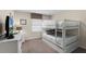 Bright bedroom with a twin-over-full bunk bed at 8947 Bismarck Palm Rd, Kissimmee, FL 34747