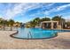 Resort-style pool with waterslide and rock waterfall feature at 8947 Bismarck Palm Rd, Kissimmee, FL 34747