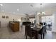Open concept dining area with seating for six and access to a patio at 8947 Bismarck Palm Rd, Kissimmee, FL 34747