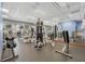Well-equipped fitness center with various exercise machines and weights at 8947 Bismarck Palm Rd, Kissimmee, FL 34747