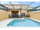Private screened-in pool with safety fence at 8947 Bismarck Palm Rd, Kissimmee, FL 34747