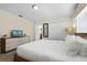 King-size bed and dresser in bedroom with ensuite bathroom at 8947 Bismarck Palm Rd, Kissimmee, FL 34747