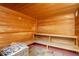 Relaxing wooden sauna with benches and tiled floor at 8947 Bismarck Palm Rd, Kissimmee, FL 34747