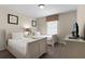 Two twin-size beds in a well-lit bedroom with window at 8947 Bismarck Palm Rd, Kissimmee, FL 34747