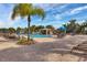 Resort-style pool with waterfall feature and lounge chairs at 8947 Bismarck Palm Rd, Kissimmee, FL 34747