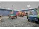 Fun game room featuring billiard tables, air hockey, and arcade games at 8947 Bismarck Palm Rd, Kissimmee, FL 34747