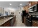 Modern kitchen with stainless steel appliances and granite countertops at 8947 Bismarck Palm Rd, Kissimmee, FL 34747