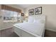 Spacious bedroom with a comfortable king-size bed and plenty of natural light at 8947 Bismarck Palm Rd, Kissimmee, FL 34747