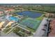 Aerial view of community pool, tennis and basketball courts at 8947 Bismarck Palm Rd, Kissimmee, FL 34747