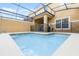 Private screened pool with safety fence at 8947 Bismarck Palm Rd, Kissimmee, FL 34747