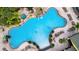 Large resort-style pool with a waterfall feature at 8947 Bismarck Palm Rd, Kissimmee, FL 34747