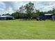 Spacious backyard with large tree and open space at 4805 Hunting Lodge Dr, Saint Cloud, FL 34772