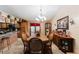 Dining room with a large table, chairs, and a chandelier at 3500 Sail Fish Ave, Fruitland Park, FL 34731