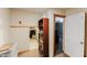 Hallway with access to the basement and shelving at 3500 Sail Fish Ave, Fruitland Park, FL 34731