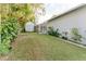 Large backyard with shed and lush landscaping at 3500 Sail Fish Ave, Fruitland Park, FL 34731