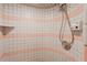 Clean shower stall with pink and white tile at 3500 Sail Fish Ave, Fruitland Park, FL 34731
