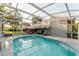 Enclosed pool area with spacious deck at 3500 Sail Fish Ave, Fruitland Park, FL 34731