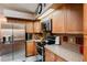 Modern kitchen with stainless steel appliances and granite countertops at 3500 Sail Fish Ave, Fruitland Park, FL 34731