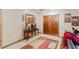 Bright entryway with wood floors, double doors, and decorative console table at 3500 Sail Fish Ave, Fruitland Park, FL 34731