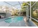 Enclosed pool with deck and stairs access at 3500 Sail Fish Ave, Fruitland Park, FL 34731