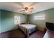Cozy bedroom with ceiling fan and window at 3500 Sail Fish Ave, Fruitland Park, FL 34731