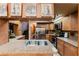 Open kitchen with island and stainless steel appliances at 3500 Sail Fish Ave, Fruitland Park, FL 34731