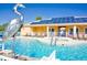 Community pool with solar panels and sculpture at 1613 Retreat Cir, Clermont, FL 34714