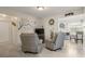 Spacious living room with two recliners and a view into the dining area at 1421 Avenue G Ne, Winter Haven, FL 33881
