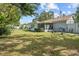 Spacious backyard with grassy lawn and shed at 1421 Avenue G Ne, Winter Haven, FL 33881
