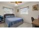 Serene bedroom with a queen-size bed and built-in storage at 1421 Avenue G Ne, Winter Haven, FL 33881