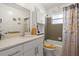 Updated bathroom with a tub/shower, vanity, and stylish decor at 1421 Avenue G Ne, Winter Haven, FL 33881