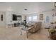Spacious living room featuring a large TV and comfortable seating at 1421 Avenue G Ne, Winter Haven, FL 33881