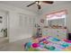 Vibrant bedroom with a bed, exercise bike and dresser at 1421 Avenue G Ne, Winter Haven, FL 33881