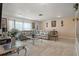 Bright living room with ample seating and tile flooring at 1421 Avenue G Ne, Winter Haven, FL 33881