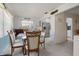 Bright dining room with glass table and chairs near kitchen at 1421 Avenue G Ne, Winter Haven, FL 33881