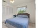Relaxing bedroom with a queen bed and ample closet space at 1421 Avenue G Ne, Winter Haven, FL 33881