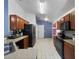 Modern kitchen with stainless steel appliances and wood cabinets at 9920 4Th Ave, Orlando, FL 32824