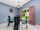 Bright dining room with glass table and four chairs at 9920 4Th Ave, Orlando, FL 32824