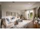 Bright living room with comfy sofas, a large TV, and sliding doors leading to the backyard at 2944 Scout Street, Saint Cloud, FL 34771