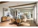 Elegant dining room with a round table, modern chairs, and hardwood floors at 2944 Scout Street, Saint Cloud, FL 34771