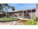 Home exterior showcasing a large screened porch and landscaped backyard at 2657 Queen Mary Pl, Maitland, FL 32751