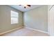 Cozy bedroom with neutral walls and carpet at 2657 Queen Mary Pl, Maitland, FL 32751