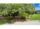 Beautiful landscaping with a park-like setting and bench at 2657 Queen Mary Pl, Maitland, FL 32751