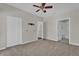 Bedroom with ceiling fan and access to bathroom and upstairs at 2514 Grand Central Pkwy # 2, Orlando, FL 32839