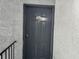 Gray apartment entrance door with building number at 4815 S Texas Ave # C, Orlando, FL 32839