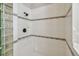 Clean bathroom with a shower stall and glass block feature wall at 372 Hinsdale Dr, Debary, FL 32713