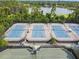 Community tennis courts with lake and homes in the background at 372 Hinsdale Dr, Debary, FL 32713