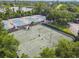 Aerial view of community tennis courts with surrounding trees and landscaping at 372 Hinsdale Dr, Debary, FL 32713
