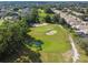 Aerial view of golf course with houses in the background at 372 Hinsdale Dr, Debary, FL 32713